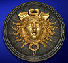 An impressive Second Empire parcel gilt and painted cast iron roundel Medusa mask